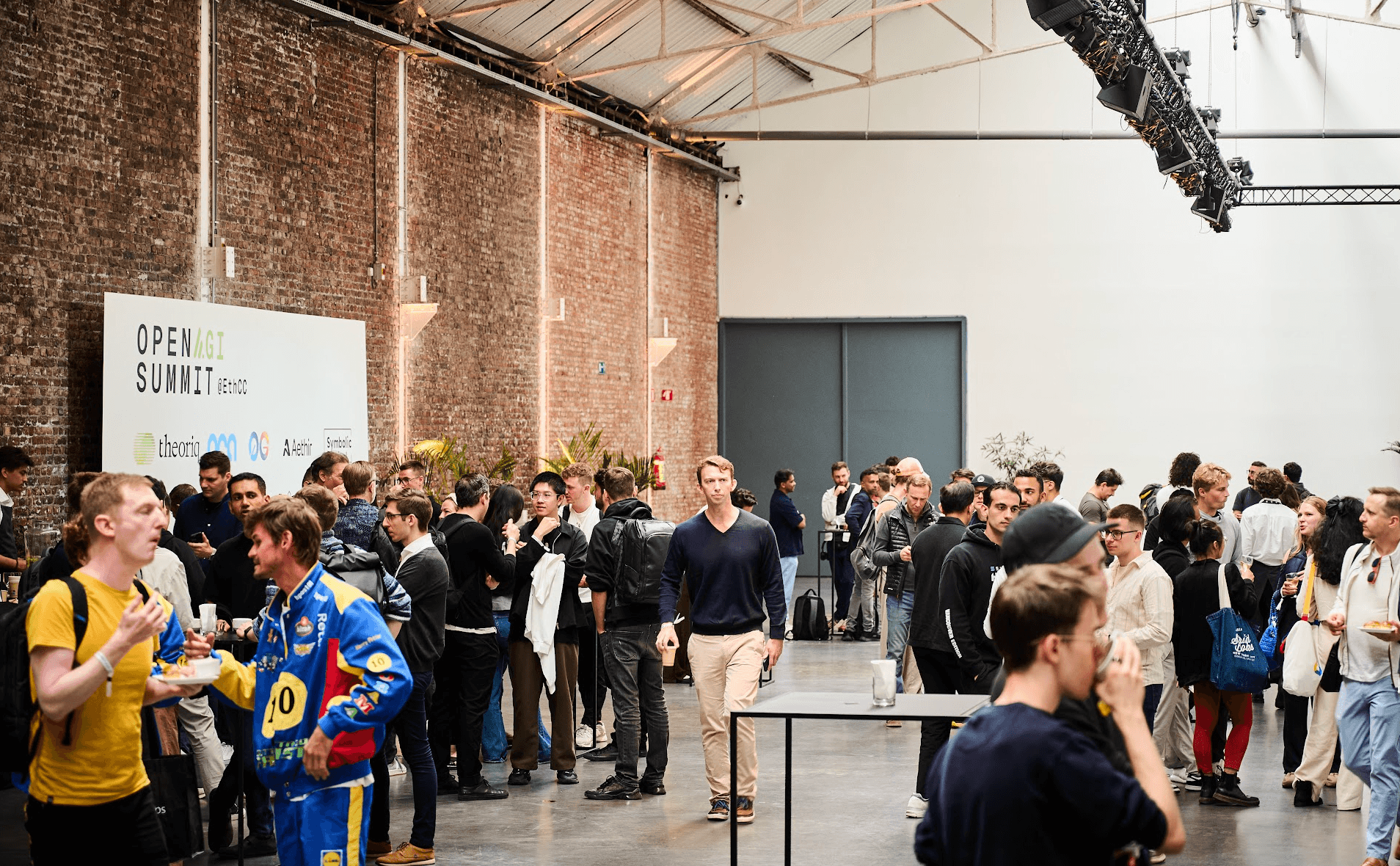 Attendees networking at an Open AGI event